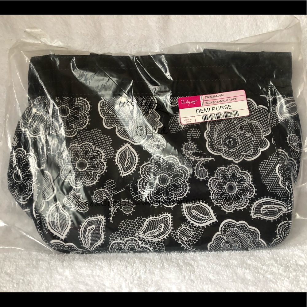 Thirty-one Demi purse in botanical lace pattern